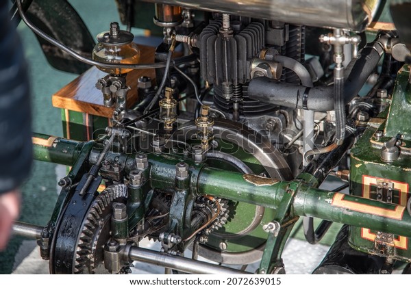 Old vintage car\
enginering show on engine and gearbox of a historic car London to\
Brigton, East Sussex, UK.