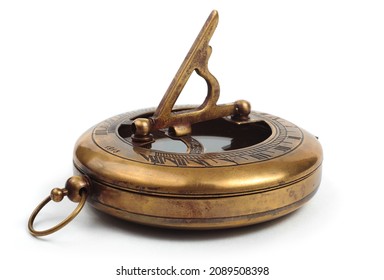 Old vintage compass with sundial on a white background.