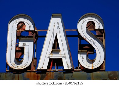 Old Vintage Gas Cafe Sign Blue Sky Worn Americana On Road Roadside