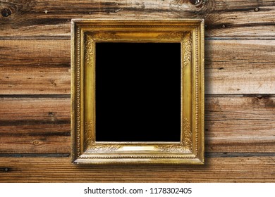 Old Vintage Gold Ornate Frame For Picture On Grunge Wooden Wall