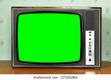 Old Vintage Green Screen TV In A Room With Vintage Wallpaper. Interior In The Style Of The 1960s.