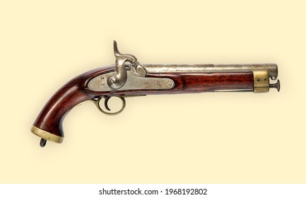 Old Vintage Hand Gun Flintlock Pistol With Wooden Handle, Viewed From The Side, Isolated On Beige Background