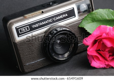 old vintage instamatic camera with pink roses