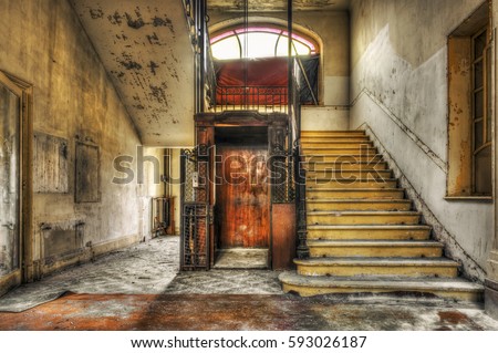 Old vintage lift at abandoned hotel lobby, HDR processing