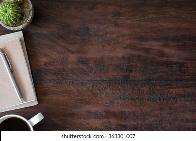 Old Vintage Office Desk Table With Notebooks, Pen And A Cup Of Coffee. Top View With Copy Space.