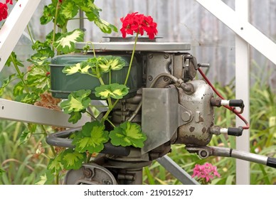 Old Vintage Outboard Boat Motor Engine, Covered In Flowers