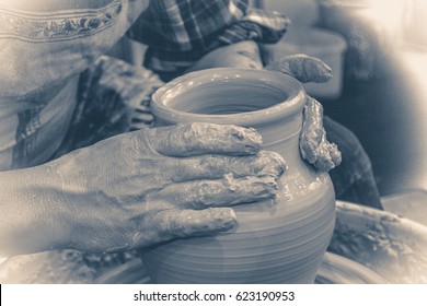 Old Vintage Photo. The Potter Molds Clay Jug Pot Closeup.