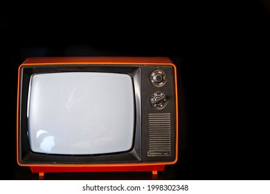 Old Vintage Red TV On Dark Background Copy Space.
