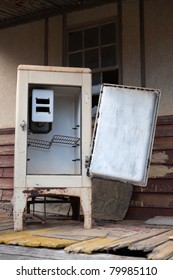 A old vintage refrigerator left outside an abandoned home