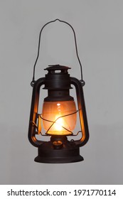 old vintage rusty kerosene black lamp isoleted on gray background. Glass oil lamp. Storm lantern. object vintage concept - Shutterstock ID 1971770114
