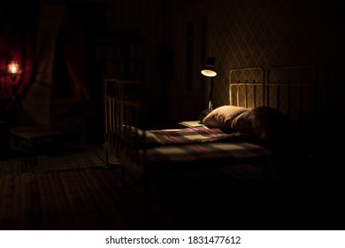 Old Vintage Single Bed At Night . A Realistic Dollhouse Bedroom With Furniture And Window. Selective Focus