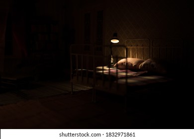 Old Vintage Single Bed At Night . A Realistic Dollhouse Bedroom With Furniture And Window. Selective Focus