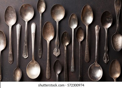 Old Vintage Spoons On Stone Table. Top View 