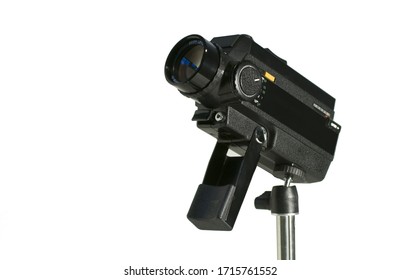 Old Vintage Super 8 Film Camera Fixed On A Stand And Isolated On A White Background