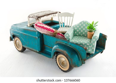 Old Vintage Toy Truck Packed With Furniture - Moving Houses Concept