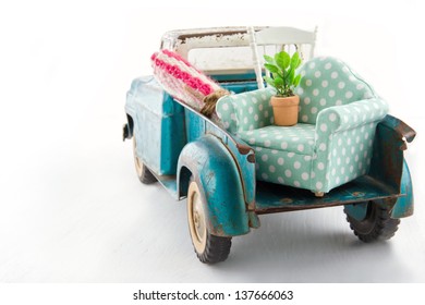 Old Vintage Toy Truck Packed With Furniture - Moving Houses Concept