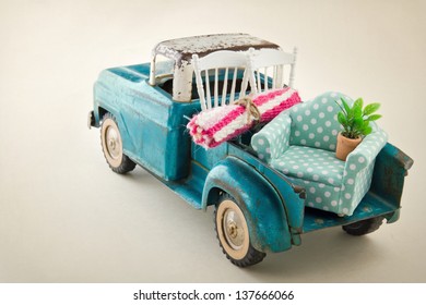 Old Vintage Toy Truck Packed With Furniture - Moving Houses Concept