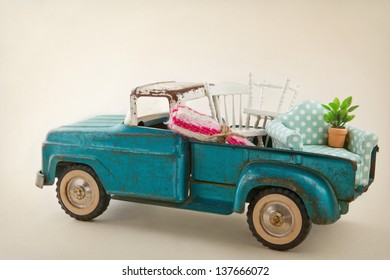 Old Vintage Toy Truck Packed With Furniture - Moving Houses Concept