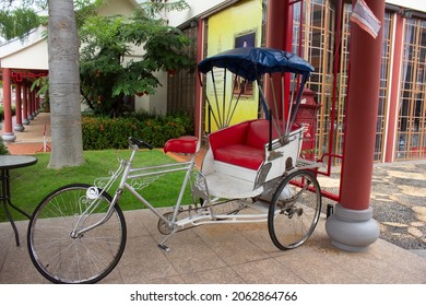 An old vintage tricycle showing for tourists to take photos at Thai-Chinese cultural center,Udon Thani,Thailand.Tricycle used to be the most hit of transportation in Udon Thani.