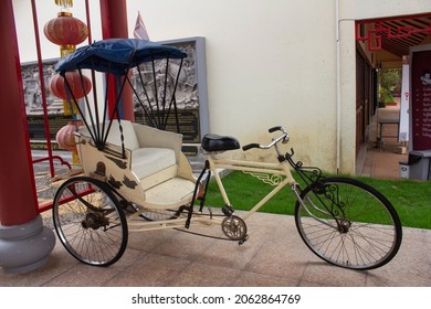 An old vintage tricycle showing for tourists to take photos at Thai-Chinese cultural center,Udon Thani,Thailand.Tricycle used to be the most hit of transportation in Udon Thani.