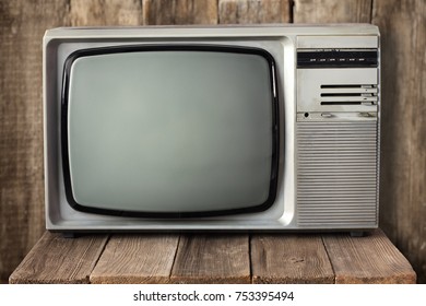 Old Vintage TV On Wooden Table. Retro Television 1990s.