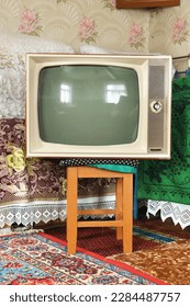 Old vintage TV in a rustic interior. - Shutterstock ID 2284487757