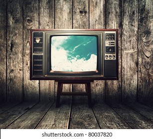 Old Vintage TV In The Vintage Wooden Room On Table With Sky View