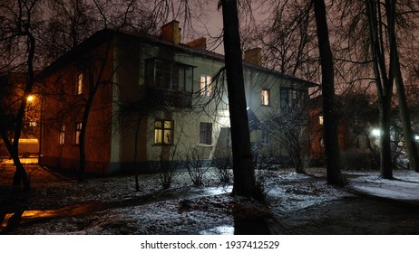 Old Vintage Two-storey Building View At Night. An Old European Brick Building At Night. An Ancient Two-storey Building Among The Trees At Night.