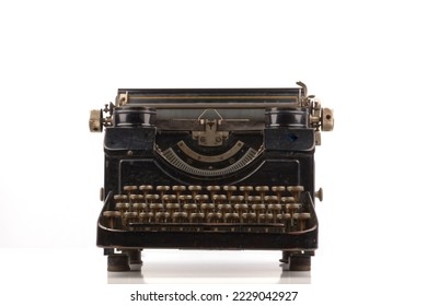 old vintage typewriter isolated on white background with real shadows