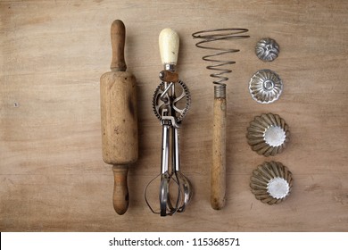Old Vintage wooden rolling Pin with hand-cranked mixer and egg beater