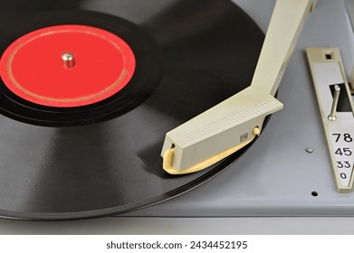 Old vinyl player with plate from 1970-s, close up