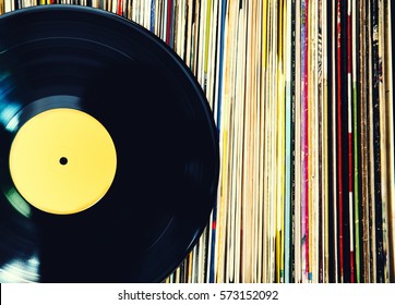 Old Vinyl Record And A Collection Of Albums.