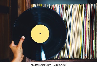 Old Vinyl Record And A Collection Of Albums.