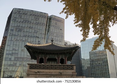 Old Vs New, City Vs Nature. Architecture Design Through Ages With A Gingko Biloba Tree In Autumn Colors.