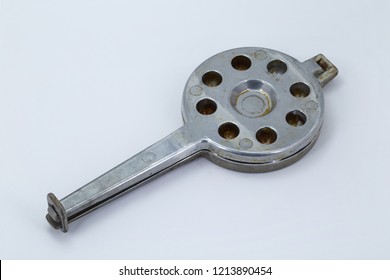 Old Waffle Iron For Baking Of Cookies In The Form Of Nutlets Of A White Background