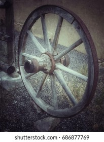 Old Wagon Wheel In Small Western Town In Utah.