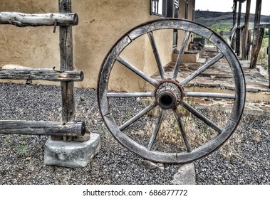 Old Wagon Wheel In Small Western Town In Utah.