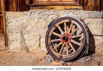 An old wagon wheel view. Vintage wagon wheel. Cart wheel. Old wagon wheel