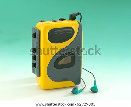 old Walkman on green background