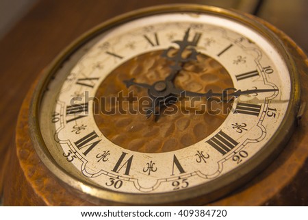 Old wall clock with roman numerals
