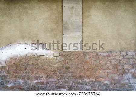 Similar – Background with plastered wall surface, bricks and wooden door