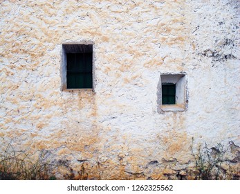 Old wall with two windows