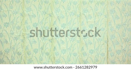 Old wallpaper on the wall. Old wallpaper for texture or background.