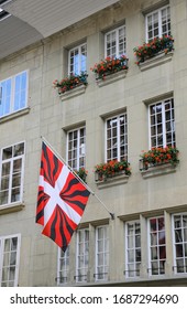 Old War Flag Of Bern (flag Of The Ancien Regime) On Grey Wall Of House In The Center Of Capital Of Switzerland