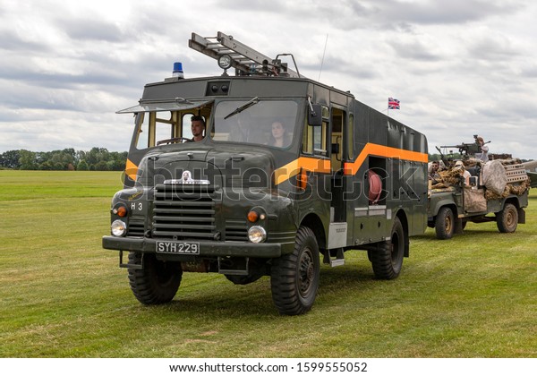 OLD\
WARDEN, BEDFORDSHIRE, UK – JULY 7, 2019: Bedford RLHZ Self\
Propelled Pump Green Goddess, Reg SYH 229, seen in the vehicle\
parade prior to the Military Airshow at Old\
Warden.