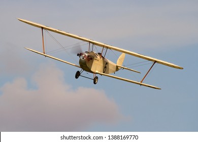 OLD WARDEN, BEDFORDSHIRE, UK – OCTOBEr 5, 2014: 1924 Hawker Cygnet (Replica) G-CAMM, a British ultralight biplane aircraft of the 1920s, on display at Old Warden during a Shuttleworth Airshow.