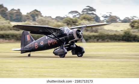 Old Warden, UK - 3rd July 2022: A Vintage Westland Lysander World War 2 Recconaissance Aircraft Lands On Grass Airfield