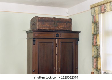 Old Wardrobe With Suitecase In A Very Old House