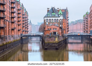 The old warehouse district (Speicherstadt) in Hamburg, Germany in winter. The largest warehouse district in the world is located in the port of Hamburg within the HafenCity quarter and is Unesco World - Powered by Shutterstock