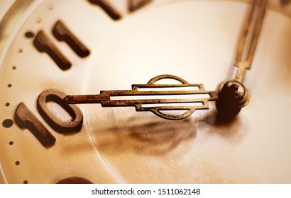 The old watch face close-up shows the time around ten o'clock and ten minutes.